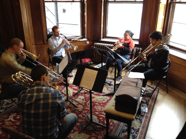 YOLA musicians Alexandra Garcia (trumpet) and Josue May (trombone) having a master class from faculty members of the Longy School of Music in Cambridge.